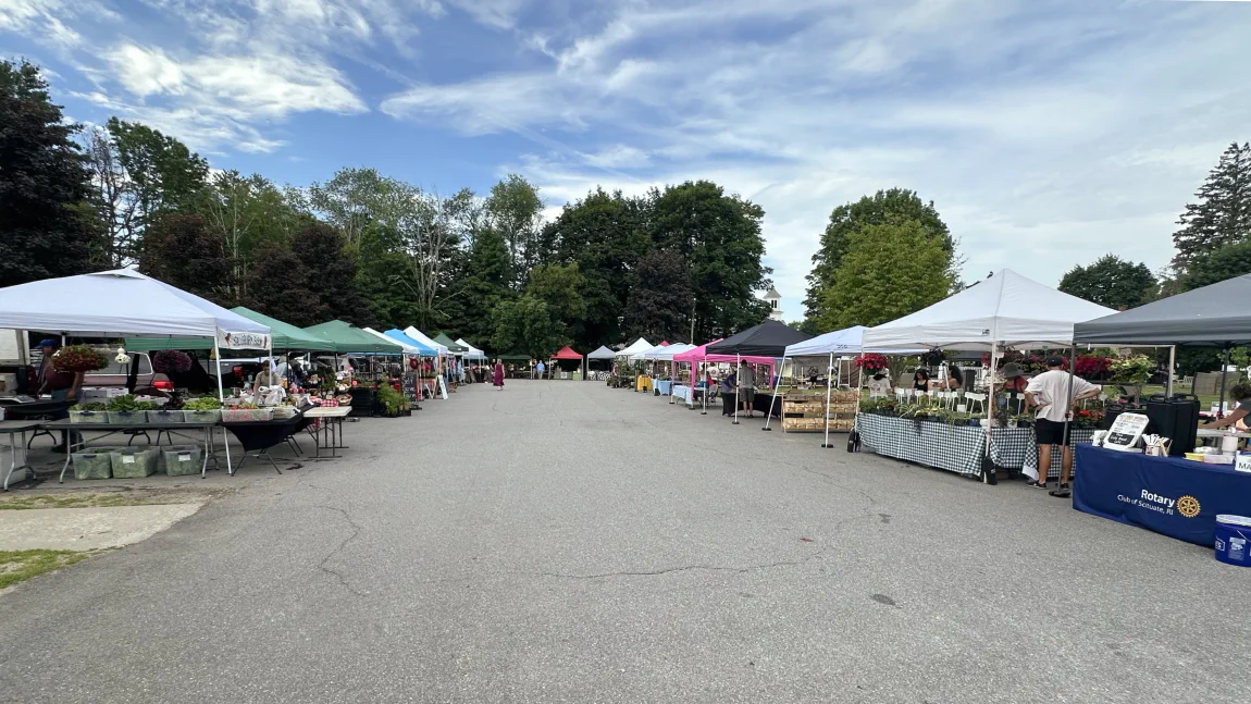Vendor tents lining the Village Green at the Scituate Rotary Farmers Market